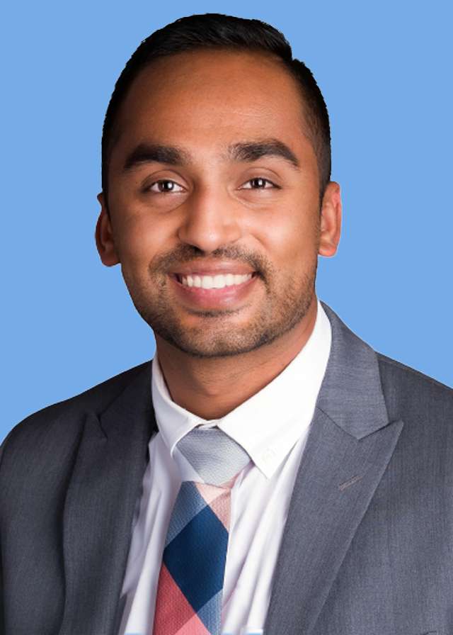 Headshot of Dr. Jay Shah in a grey suit