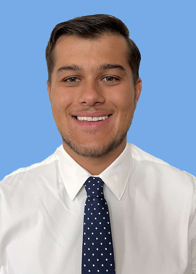 headshot of Dr. Samuel Bolivar in a white shirt and dark tie