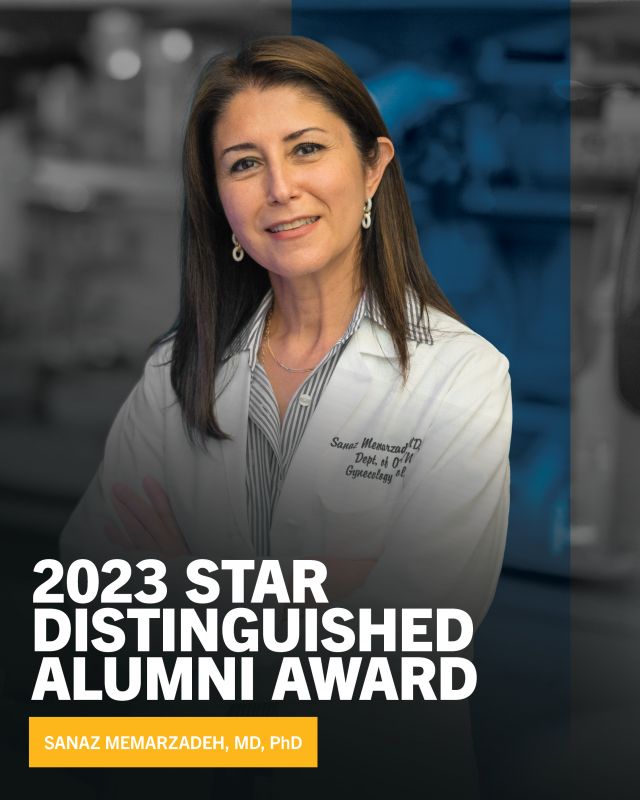 Dr. Sanaz Memarzadeh smiling in front of a blue UCLA backdrop after receiving a 2023 STAR Distinguished Alumni Award.