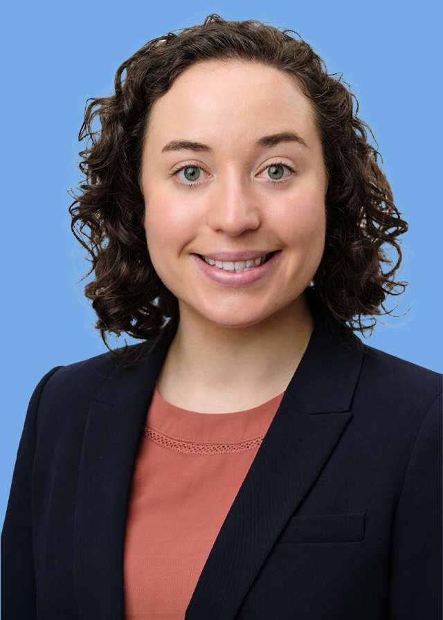 headshot of Sophie Roenmoss in black blazer