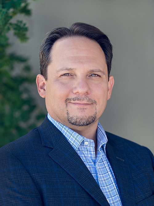 Headshot of Jamiln Zam in an indoor setting