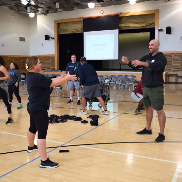 Teachers toss sandbell at SBSM training
