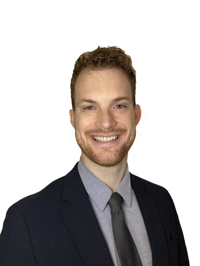 Dr. Atwood headshot. He's wearing a gray button up shirt, a black tie and a black suit.