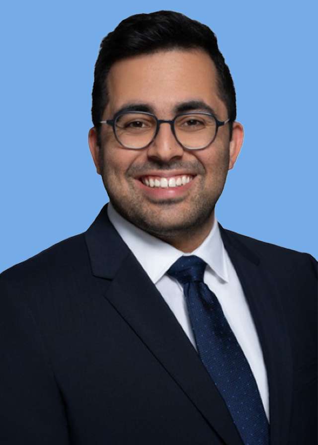 headshot of Dr. Sammy Sayed in a black suit and tie