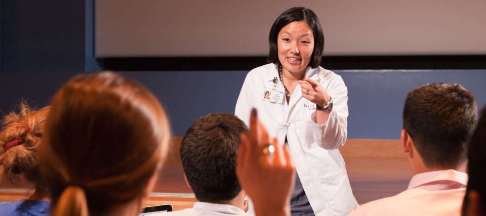 Medical students and professor in training class