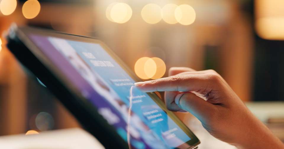 Hand at computer tablet
