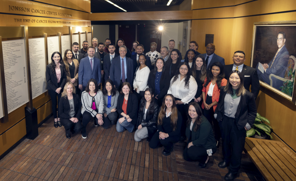 UCLA Health Jonsson Comprehensive Cancer Center staff posing together, showcasing a dedicated team of medical professionals.
