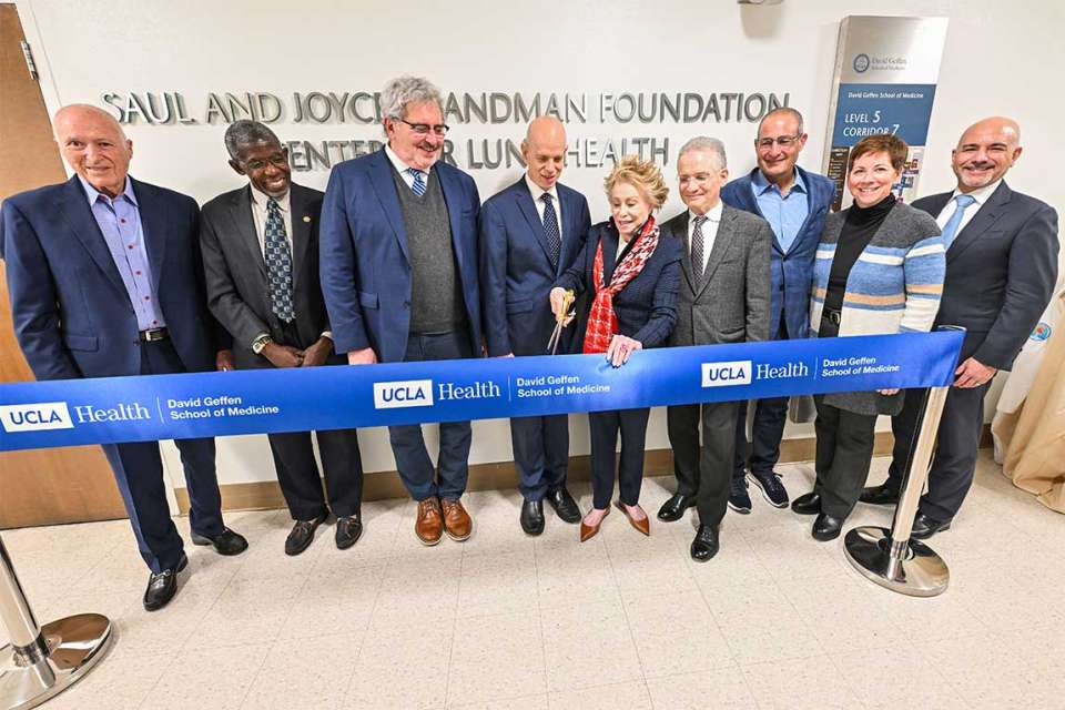 Friends of U Magazine Summer 2025 standing together for a ribbon cutting event.