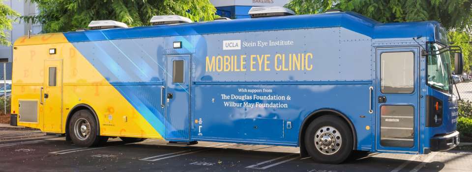 Horizontal photo of the new blue and gold mobile eye clinic bus