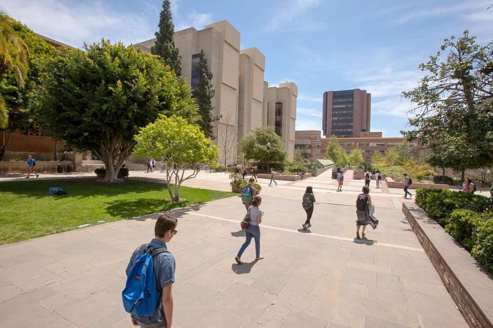 Students walking across UCLA Court of Sciences