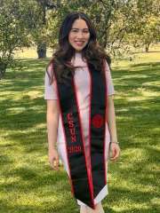 Arlyn, who has brown hair, wearing a class of 2020 CSUN graduation stole