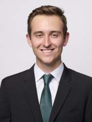 Dr. Brendan Colgan in a suit smiling at the camera