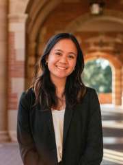 head shot of Sophie Viray, who has brown hair, wearing a black blazer
