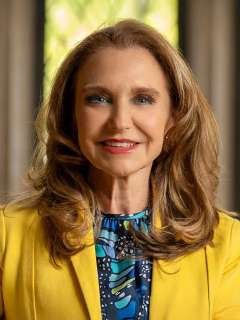 Cancer researcher Dr. Felicia Knaul looking and smiling at the camera