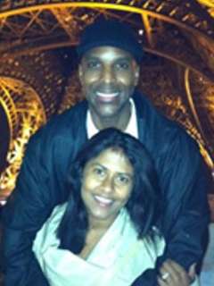 The patent Ed and with arms around his wife.