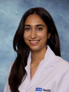 Dr. Sonali Nayak smiling and wearing her UCLA Health white lab coat.