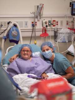 Dr. Rachel Thompson visits with her patient, Scarlett Ferguson.