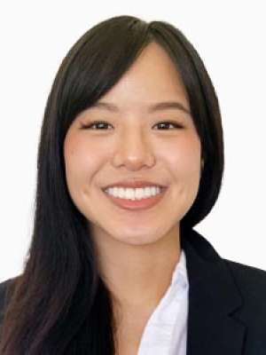 Jennifer M. Li smiling headshot in blazer and white shirt