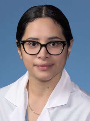Alexandra Elias, MD in a white lab coat