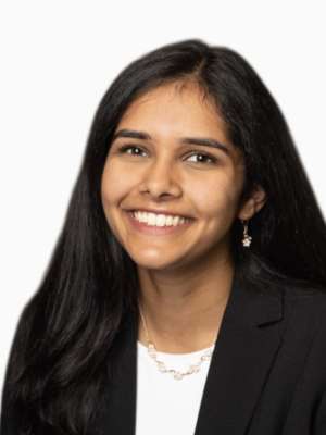 Nanda Nayak smiling headshot in blazer