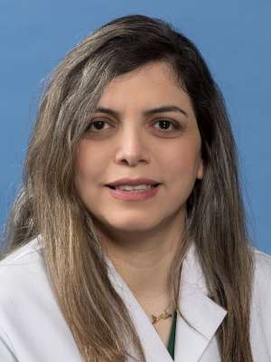 Hania Shakeri, MD in a white lab coat