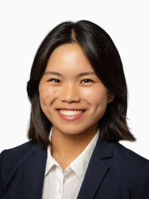 Samantha Cheng smiling professional headshot wearing navy blazer and white shirt