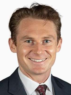 Smiling professional man in suit and tie headshot