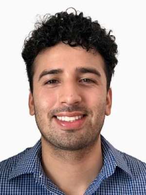 Osiel Cecenas smiling headshot against white background