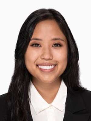 Takakusagi Melia smiling professional headshot in white blouse and black blazer