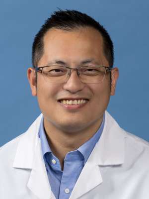 Jeffrey Chang, MD in a white lab coat
