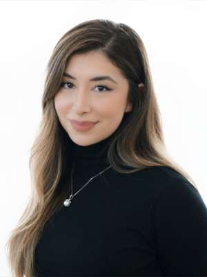 headshot of Karina Velazquez in a black turtleneck