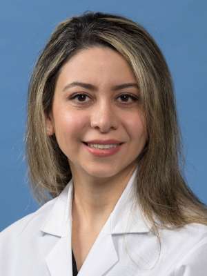 Samira Mortazavi, MD in a white lab coat