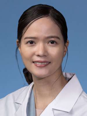 Chayanit (Katie) Jumniensuk, MD in a white lab coat