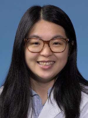 Julia Chen, MD in a white lab coat