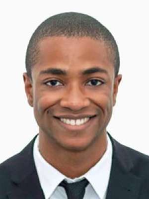 Smiling man headshot wearing suit and tie