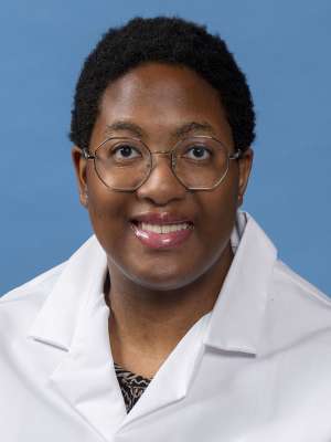 Bettie Yeboah, MD, MD in a white lab coat