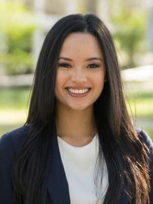 Rejah Nabong wearing a blue blazer and white blouse