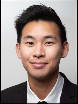 headshot of Andrew Lai wearing a black suit in front of a white background