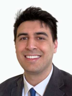 Smiling man in suit and tie headshot on white background
