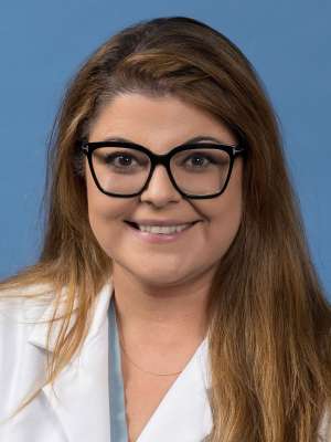 Amanda Zand, MD in a white lab coat