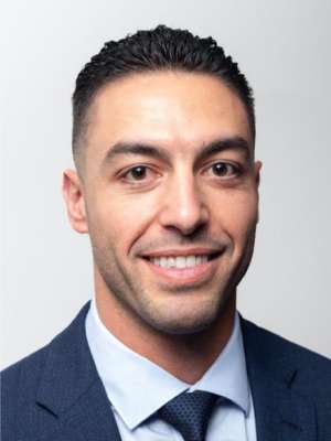 headshot of Karim Fahmy in dark blue suit