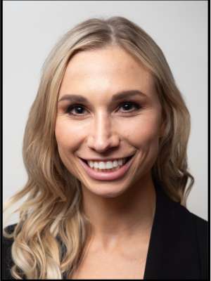 headshot of Helena Drolshagen wearing a black blouse in front of a white background