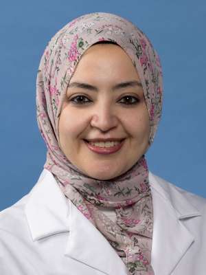 Mai Elzieny, MD in a white lab coat