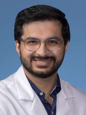 Rak Tyagi, MD in a white lab coat