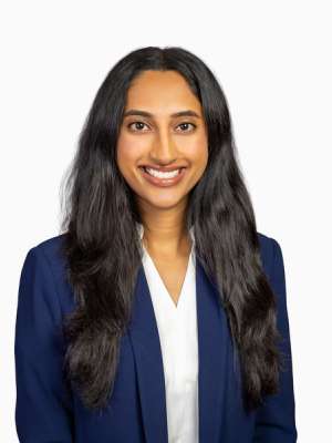 Shriram Shreya smiling in a professional headshot wearing a navy blazer