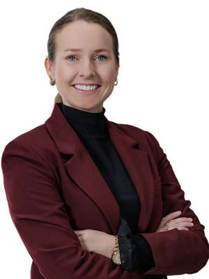 headshot of Brenda Sanz in a burgundy blazer