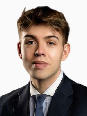 Headshot of a young man in a dark suit and tie on a white background