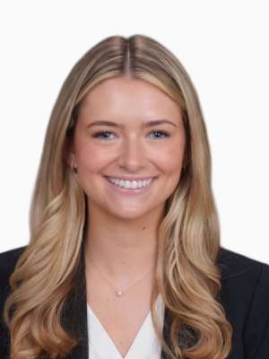 Lindsey Schneider smiling professional headshot, blazer and white blouse.