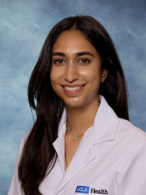 Dr. Sonali Nayak smiling and wearing her UCLA Health white lab coat.