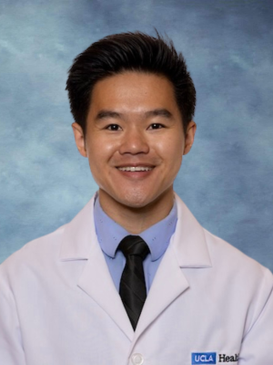 Headshot of Dr. Nilson Wu in front of a blue background